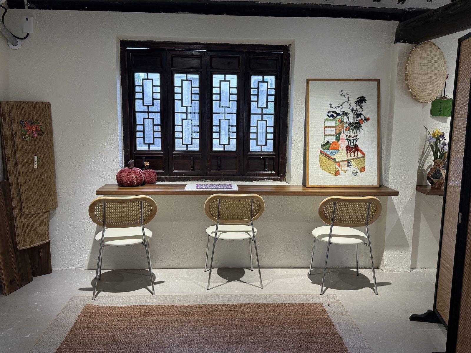 Counter seats beneath a lattice window in Xinchang, Shanghai