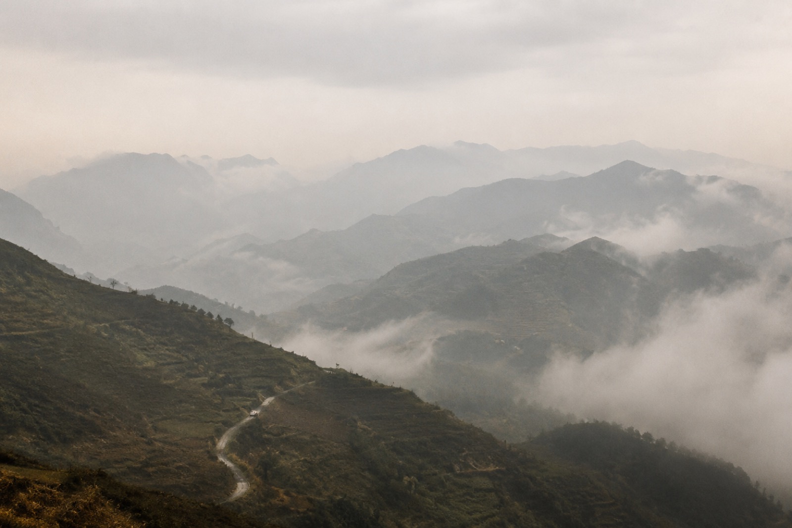 Misty mountain terraces and layered hills